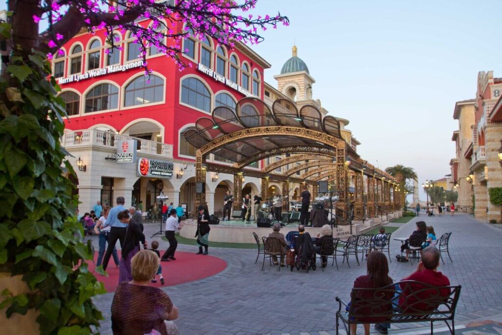 People sitting watching live music performance